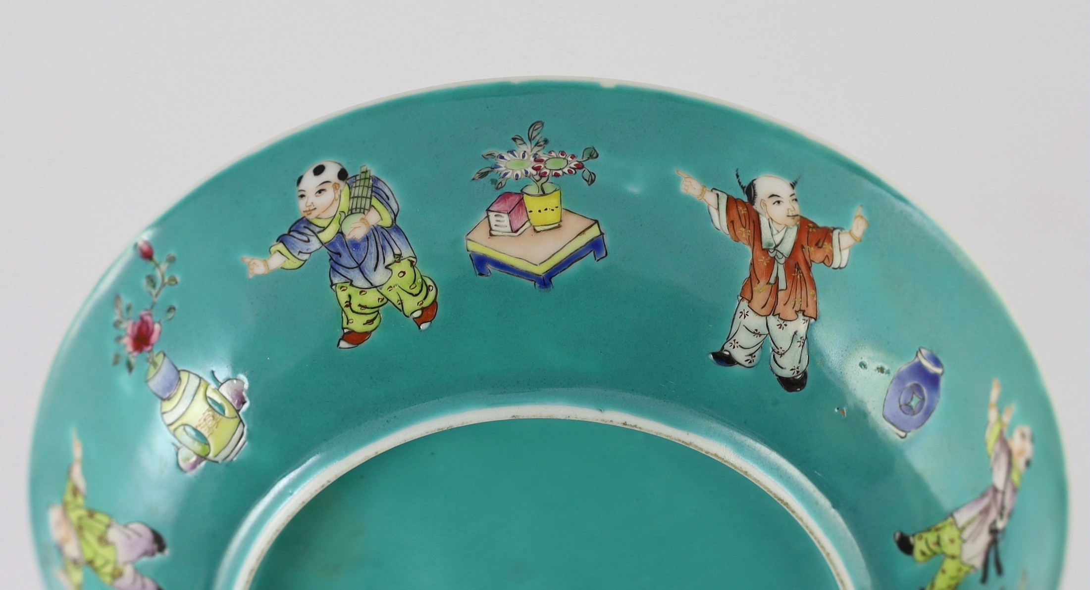 A Chinese turquoise ground 'Boys' dish, Jiaqing seal mark but Republic period, 23.5cm diameter, two hairline cracks